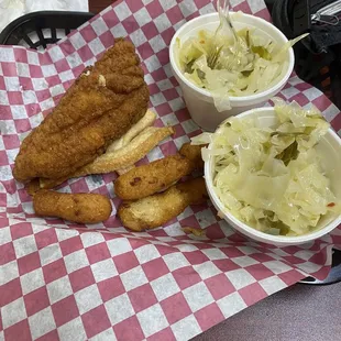 Catfish, cabbage, fat back, and hush puppies