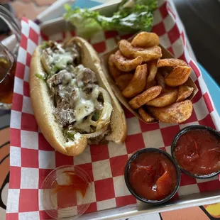 Philly cheesesteak with curly fries