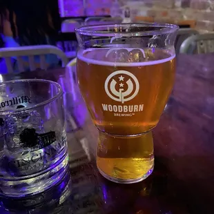 a glass of beer and a shot of water