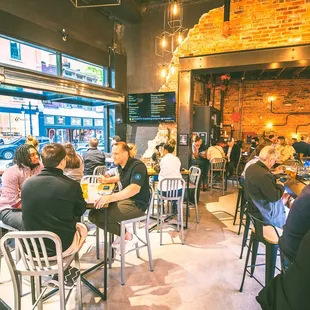 a large group of people sitting at tables