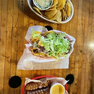 Spinach and artichoke dip, nachos, pretzels and beer cheese