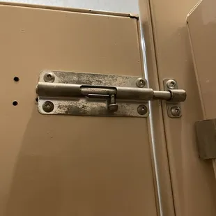 This latch was hard to open.  Got me stuck inside the ladies restroom!  Hubby came in to lift it up and slide it.....