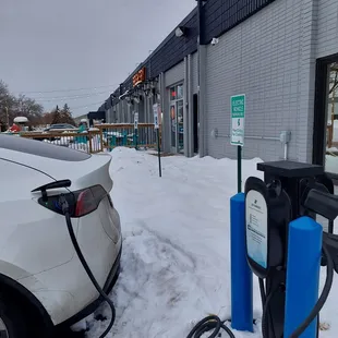 Free electric car charging next to the patio