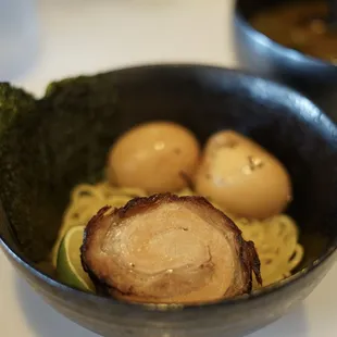 a bowl of ramen noodles with broccoli