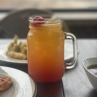 a jar of jam and a plate of food