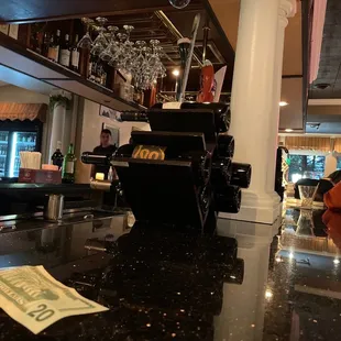 a bar with a bill on the counter