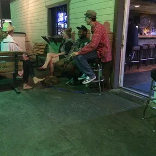 a group of people sitting on a bench