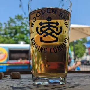 a glass of beer on a table