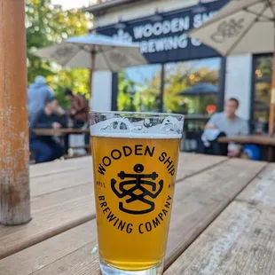 a glass of beer on a table