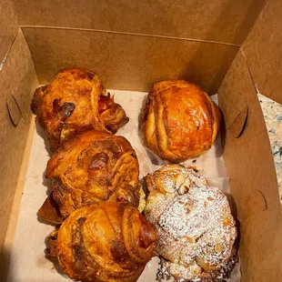 Prosciutto and Swiss on the left (our favorite) and pain au chocolate on top right and almond croissant on bottom right (a sweet must).