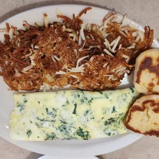 My feta cheese and spinach omelet with hash browns and biscuit.