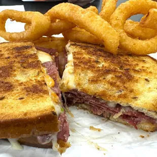 Reuben with onion rings.