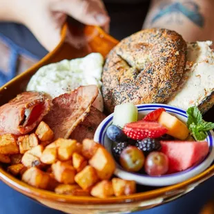 a person holding a plate of food