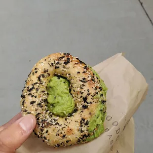 Dry, crumbly gluten free bagel with mushy avocado.