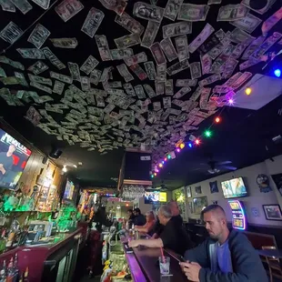 Dollar bills on the ceiling