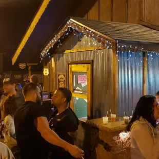 a crowd of people at a bar