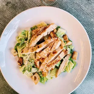 a plate of chicken and lettuce