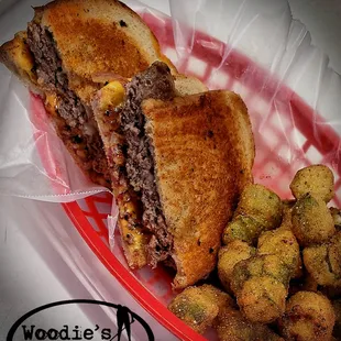 a grilled cheeseburg sandwich and fried tater tots