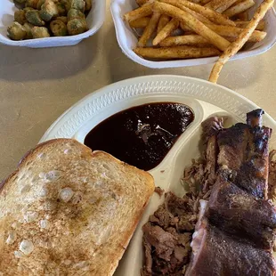 a plate of meat and french fries