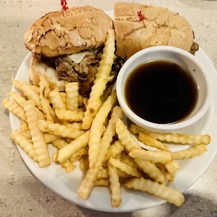 a plate of french fries and a sandwich