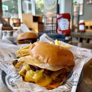 Eggstraordinary Burger $8.49 - FRIED EGG, 2 STRIPS OF SMOKEY APPLE BACON,WITH 2 SLICES OF CHEDDAR CHEESE