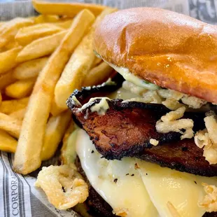 a close up of a sandwich and french fries