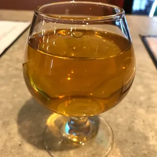 a glass of wine on a table