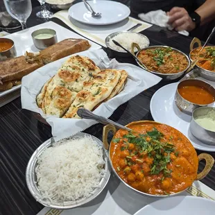 Our spread! Aloo Channa Chana Masala Garlic Naan Onion Masala Dosai Pesarat Uppuma Special Vegetable Curry