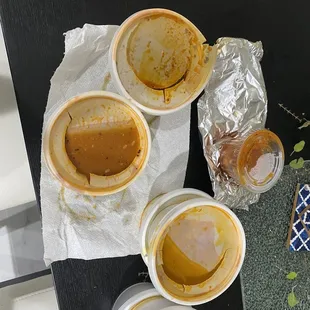 Broken lids and spilled food