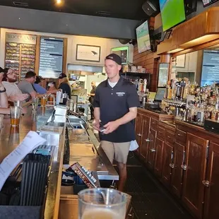 a man standing at the bar
