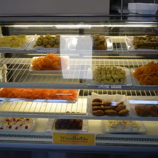 a display case filled with assorted pastries