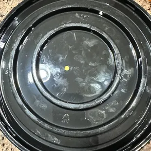 Orange dot on the bottom of the container. This must mean expired.