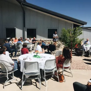 Pastor Rich sharing about Woodmen Heights at a summer time Woodmen Welcome