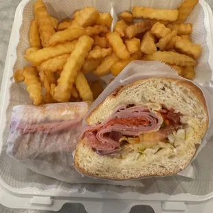 Italian Cold Cut Combo: Genoa salami, pepperoni, mortadella, provolone, onions, lettuce, tomatoes, mayonnaise, oil & vinegar & hot peppers.