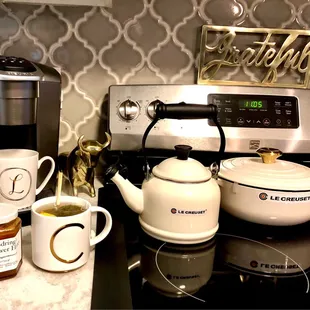 a coffee maker, tea kettle, and other kitchen items