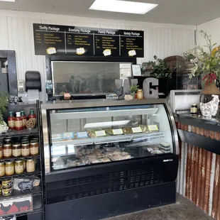 a deli counter with a variety of food items