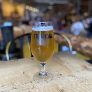 a glass of beer on a table