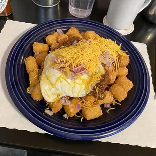 Breakfast special, tater tots, chili onions, one egg type of cheddar cheese. Large portion tasty and filling.