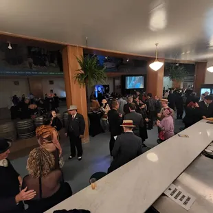 a large group of people at the bar