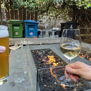 The outdoor fire pit, replete with garbage cans and random rubbish.