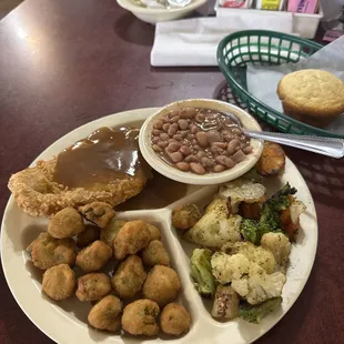 Pork chops, pinto beans, grilled veggies, fried okra and a corn bread muffin
