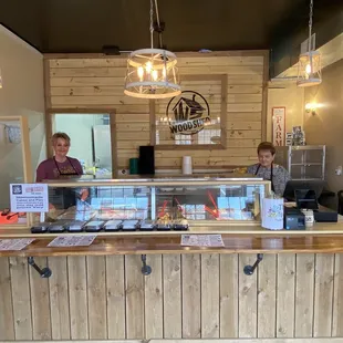 two people behind the counter