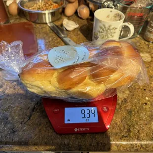 a bag of bread on a scale