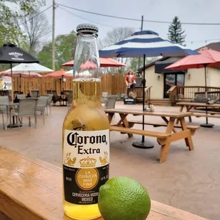 a bottle of corona extra with a lime