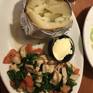 Chicken and spinach with baked potato.