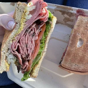 Pastrami sandwich (toasted rye bread). Comes with pickle and a bag of chips.