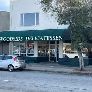 a car parked in front of the store
