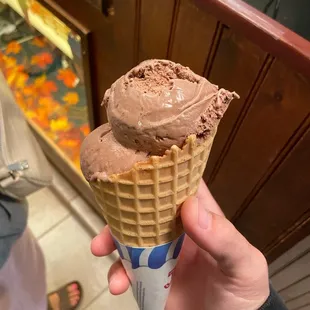 1 scoop of Chocolate PB and 1 scoop of Cappuccino Crunch in a waffle cone