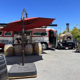 a group of people sitting under an umbrella