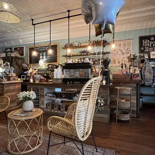 the interior of a shop with wicker furniture